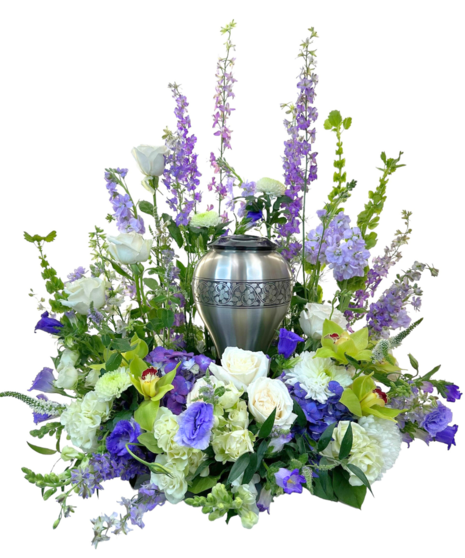 Arrangement of bright summertime flowers with a lovely urn in the center.