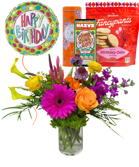 Bright and colorful arrangement featuring roses, callas and more.