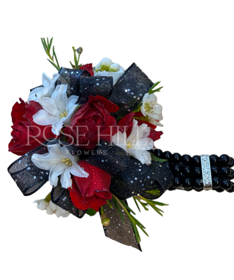 Custom rose wrist corsage designed for formal events