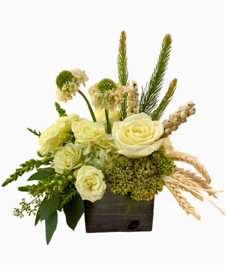 Vase of gerbera daisies in fall colors.