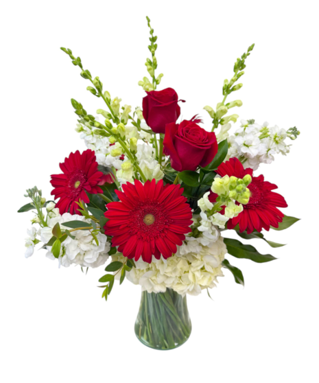 Red and white flowers in a mache sympathy basket can honor your loved one inside or outside.