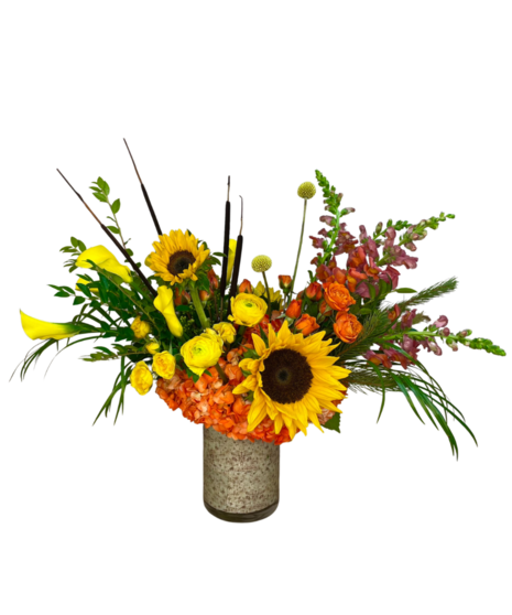 Bright and colorful arrangement featuring roses, callas and more.